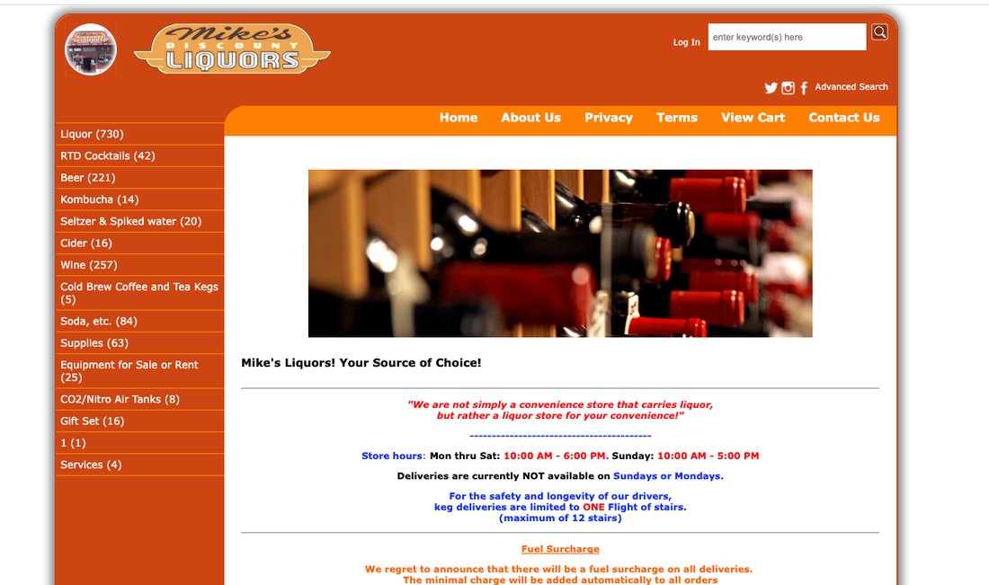 Mike&rsquo;s Liquors&rsquo; original storefront: a dense orange template with a long category sidebar and a wall of red and blue notice text.